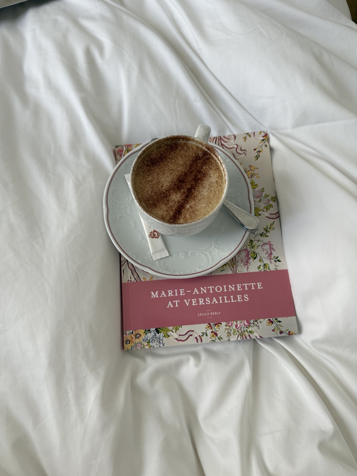 Coffee with a book about Versailles
